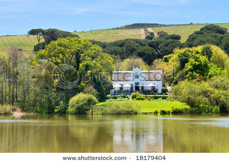 stock_photo_big_house_next_to_lake_and_hills_shot_in_kuils_river_winelands_near_stellenbosch_cape_town_18179404.jpg