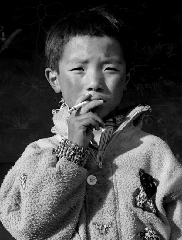 tibet____child_smoking_by_emma510.jpg