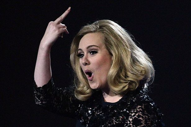 Adele_collects_her_award_for_Album_of_the_Year_during_the_2012_Brit_awards.jpg