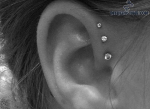 triple_anti_helix_piercing_on_ear.jpg